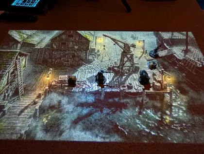 Map LUMX projetée sur une vraie table de jeu