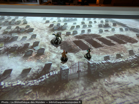 LUMX projector on its tripod above a tabletop RPG table