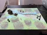 Projecteur LUMX installé sur son trépied au-dessus d'une table de JDR