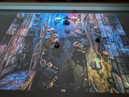 Map LUMX projetée sur une vraie table de jeu